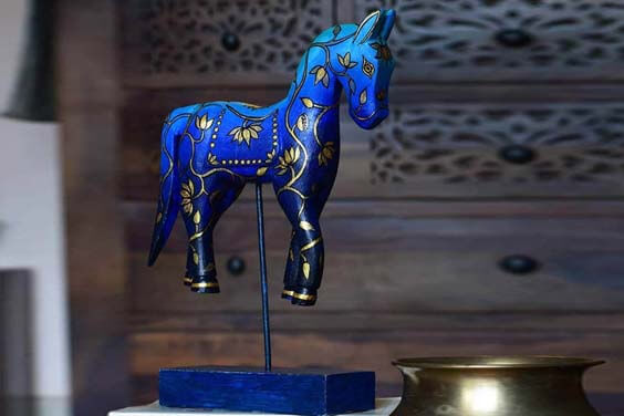 Wooden horse on stand